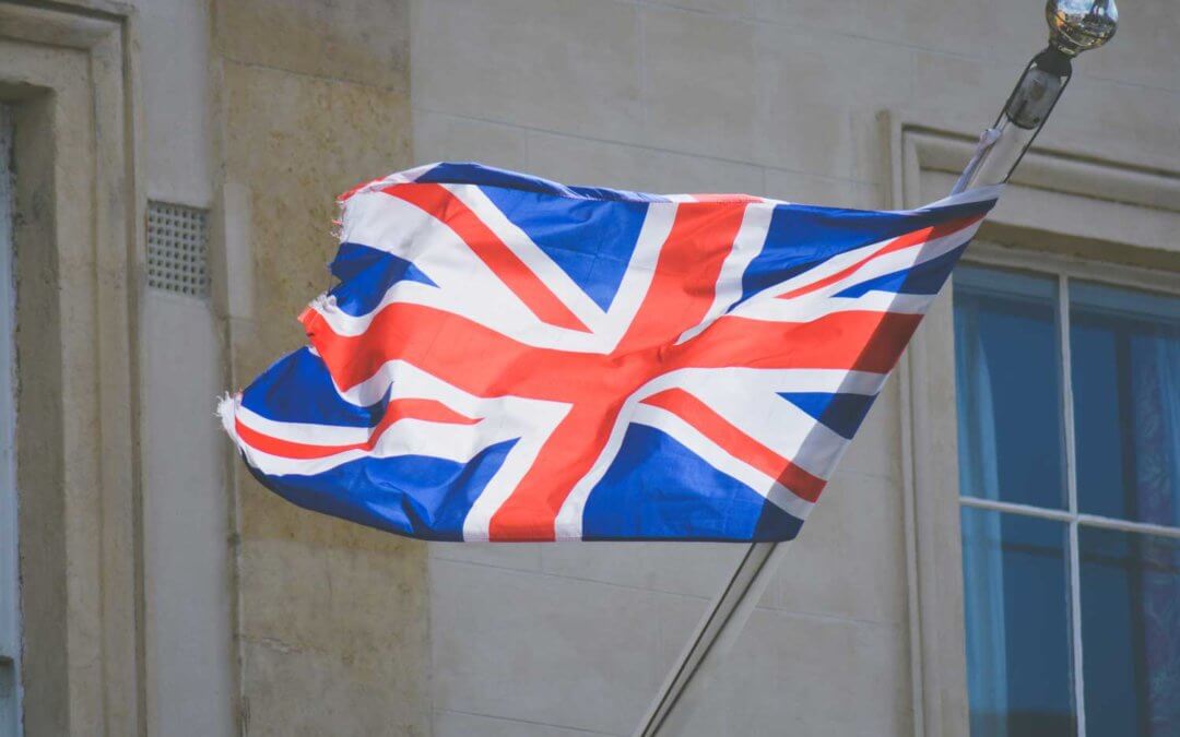 Union Jack flag in the breeze on a flag pole