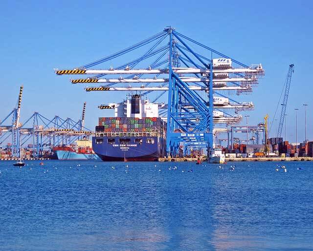 cargo ship and cranes in port