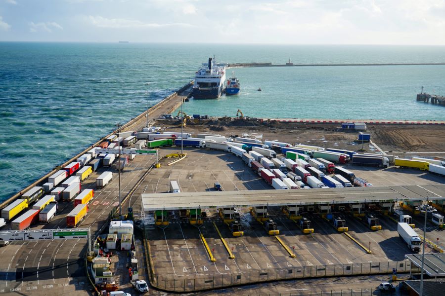 International sea port with freight trucks disembarking